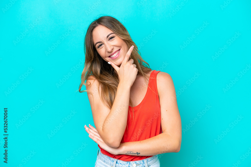 Young caucasian woman isolated on blue background happy and smiling Young caucasian woman isolated on blue background happy and smiling