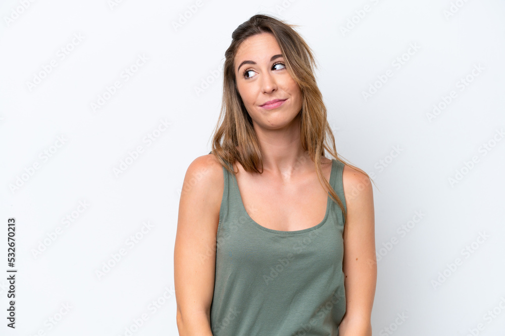 Young caucasian woman isolated on white background making doubts gesture looking side Young caucasian woman isolated on white background making doubts gesture looking side