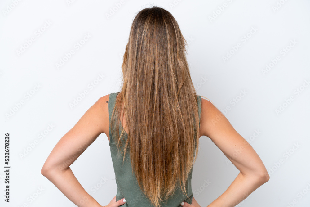 Young caucasian woman isolated on white background in back position Young caucasian woman isolated on white background in back position