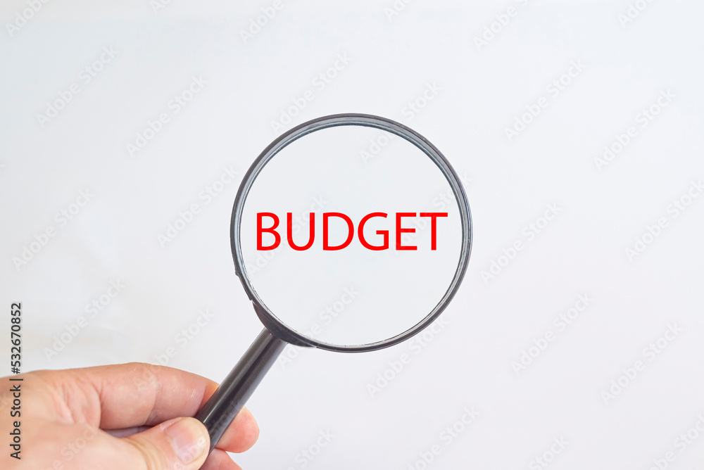 The text BUDGET in the magnifying glass.
hand holding a magnifying glass.
Detective and Search risk Idea Concept. The text BUDGET in the magnifying glass.
hand holding a magnifying glass.
Detective and Search risk Idea Concept.