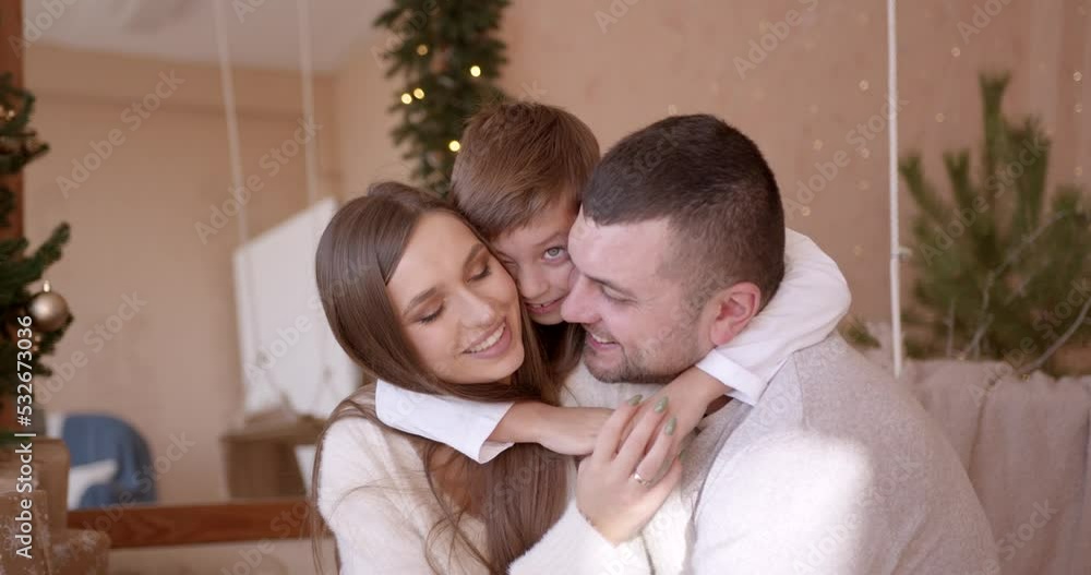Happy family having fun and playing together near Christmas tree Happy family having fun and playing together near Christmas tree