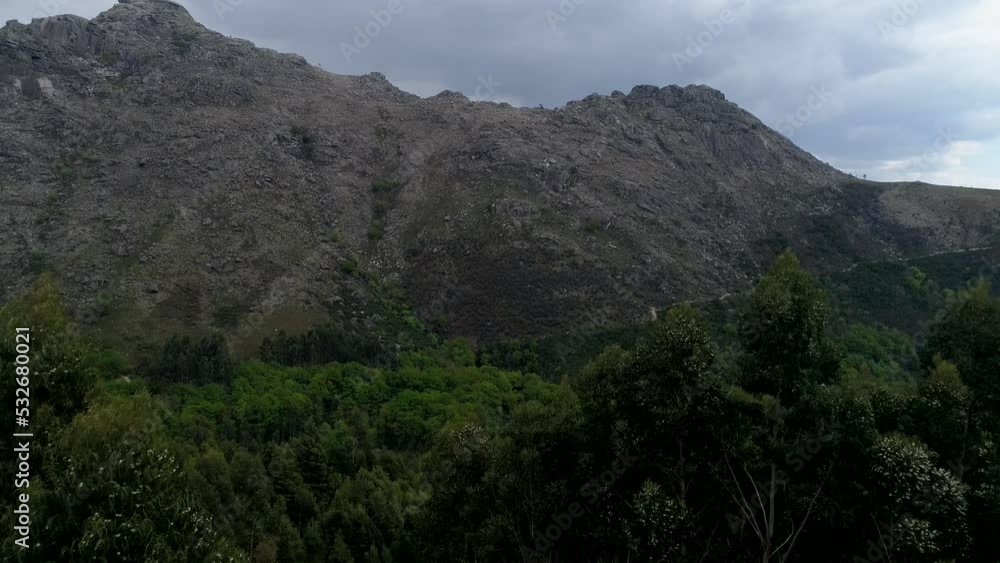 Aerial View of a Stunning Mountain on a Cloudy Day. Nature Landscape. Nature Background. Mountain Rock. Mountain Peak. Aerial View of a Stunning Mountain on a Cloudy Day. Nature Landscape. Nature Background. Mountain Rock. Mountain Peak.