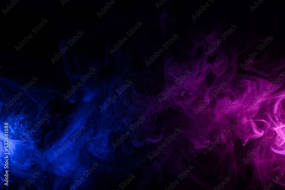 Fototapeta premium Flowing clouds of colorful swirling blue and purple neon smoke dark abstract background