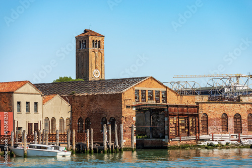 Murano island, bell tower of the Cathedral, Basilica of saints Maria and Donato, VII century, and abandoned ancient glass factories. Venice lagoon, UNESCO world heritage site, Veneto, Italy, Europe.