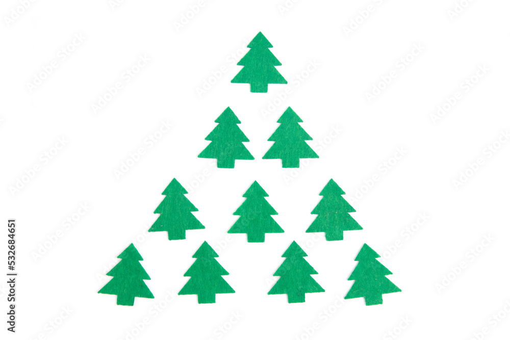 Gift wrapping option in the form of a felt Christmas tree. Christmas bright composition. Christmas background for presentation of work or text. Copy space. Top view. Isolated. Gift wrapping option in the form of a felt Christmas tree. Christmas bright composition. Christmas background for presentation of work or text. Copy space. Top view. Isolated.