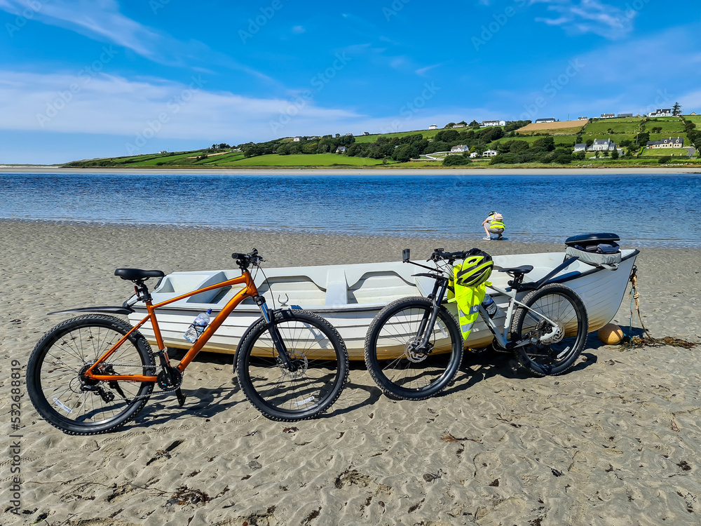 Fototapeta premium Concept of enjoying the outdoors by bicycle and boat at Gweebarra Bay , County Donegal - Ireland
