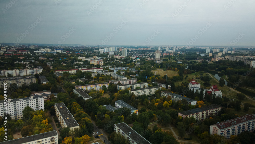Fototapeta premium Multi-storey buildings with infrastructure. Densely populated urban area. Overcast weather. Aerial photography.