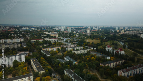 Multi-storey buildings with infrastructure. Densely populated urban area. Overcast weather. Aerial photography.