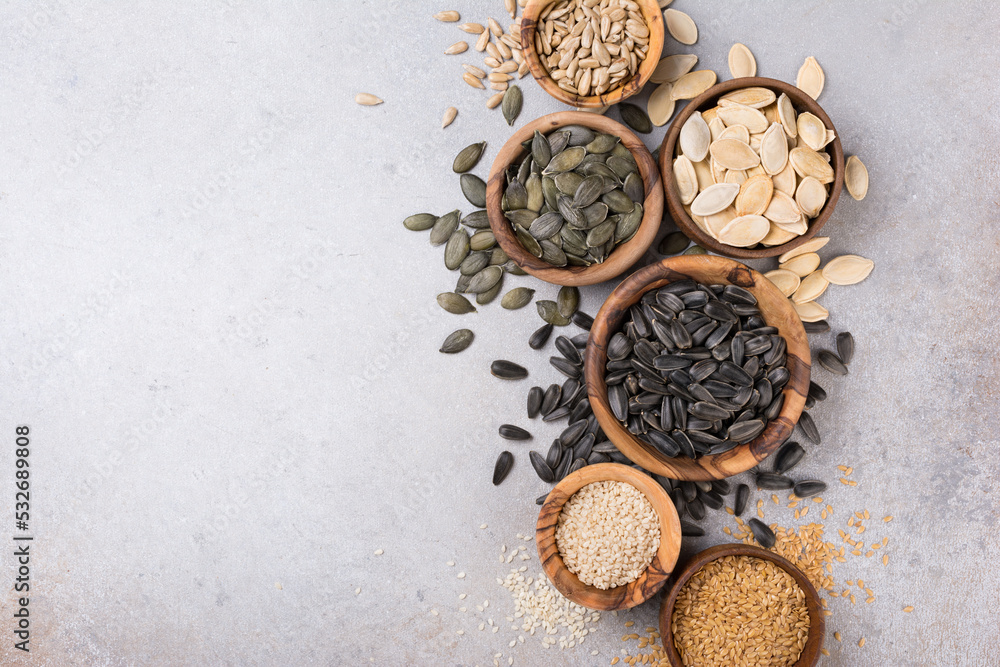 Bowls with different seeds as ingredient for oil and healthy meal Bowls with different seeds as ingredient for oil and healthy meal