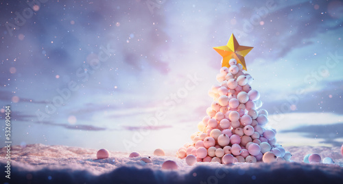 Christmas tree made with glass balls in snow winter scene