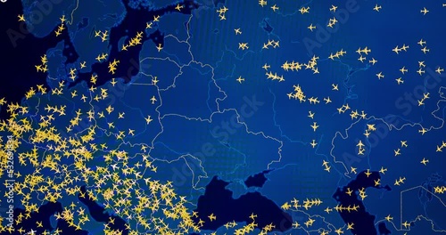 Time lapse of busy air traffic over map on digital screen.
 photo