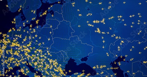 Time lapse of busy air traffic over map on digital screen.
