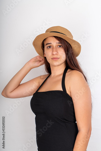 Photography Woman with hat posing on isolated white background, selective focus shot