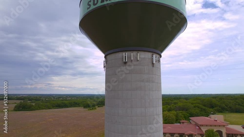 A ascending aerial drone shot of a water tower in Lee's Summit Missouri photo