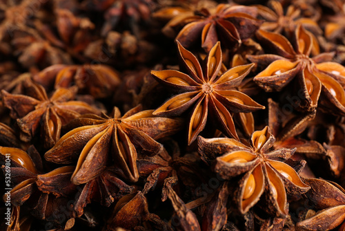Aromatic anise stars as background, closeup view