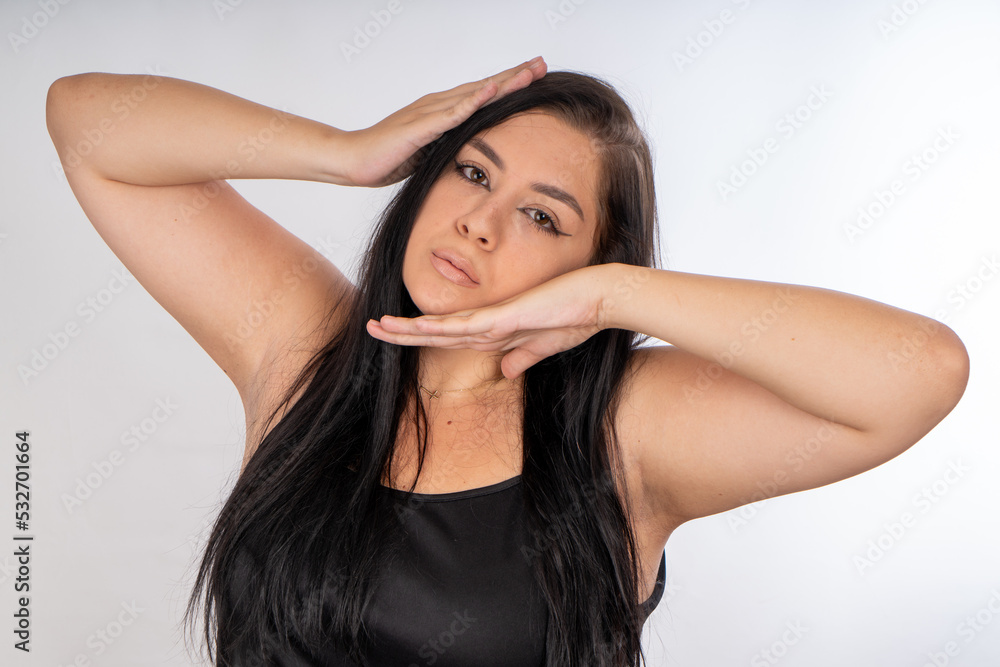 Woman posing on isolated white background, selective focus shot. Woman posing on isolated white background, selective focus shot.