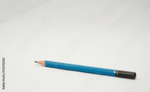 blue pencil on white background