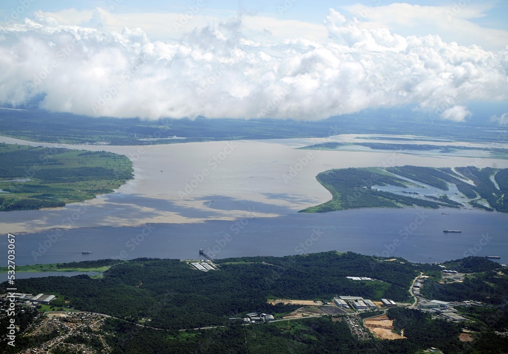 Meeting of the Rio Negro with the Rio Solimoes near Manaus. Here you can clearly see how the two rivers flow side by side for several km without mixing. Manaus - AM, Brazil.