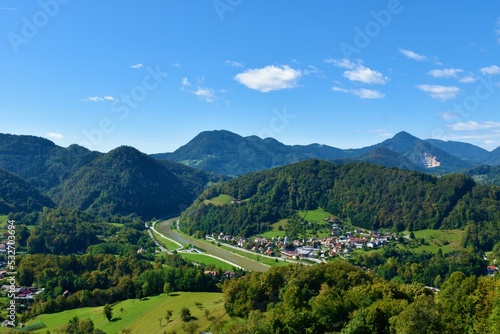View of Savinja river valley surrounded by aforest covered hills in Slovene Prealps in Stajerska, Slovenia photo