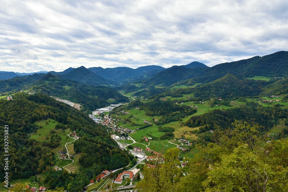 View of Sava hills in Slovene Prealps and an industrial district in the town of Lasko in Stajerska, Slovenia