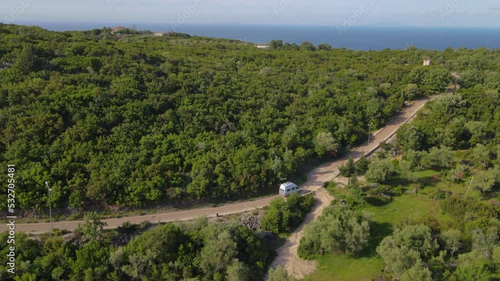 A van moving on the track of the coastline of the ocean, Captured by drone, Albania. A van moving on the track of the coastline of the ocean, Captured by drone, Albania.