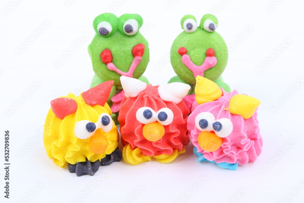 Fototapeta premium Doll made of colored sugar isolated on white