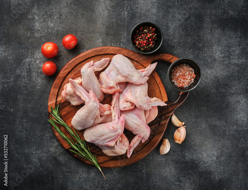 Raw chicken wings Poultry meat on a grey background. Top view
