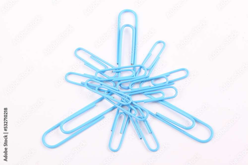 closeup blue paper clip on white background with clipping path closeup blue paper clip on white background with clipping path