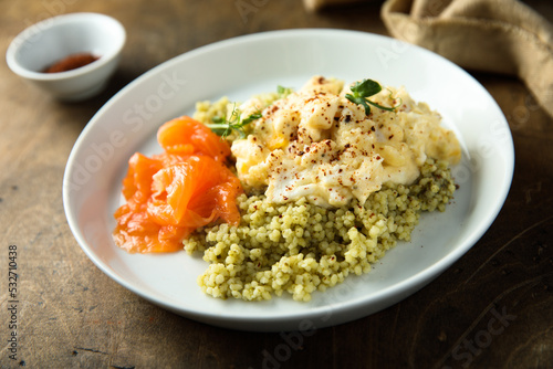 Scrambled eggs with couscous and smoked salmon