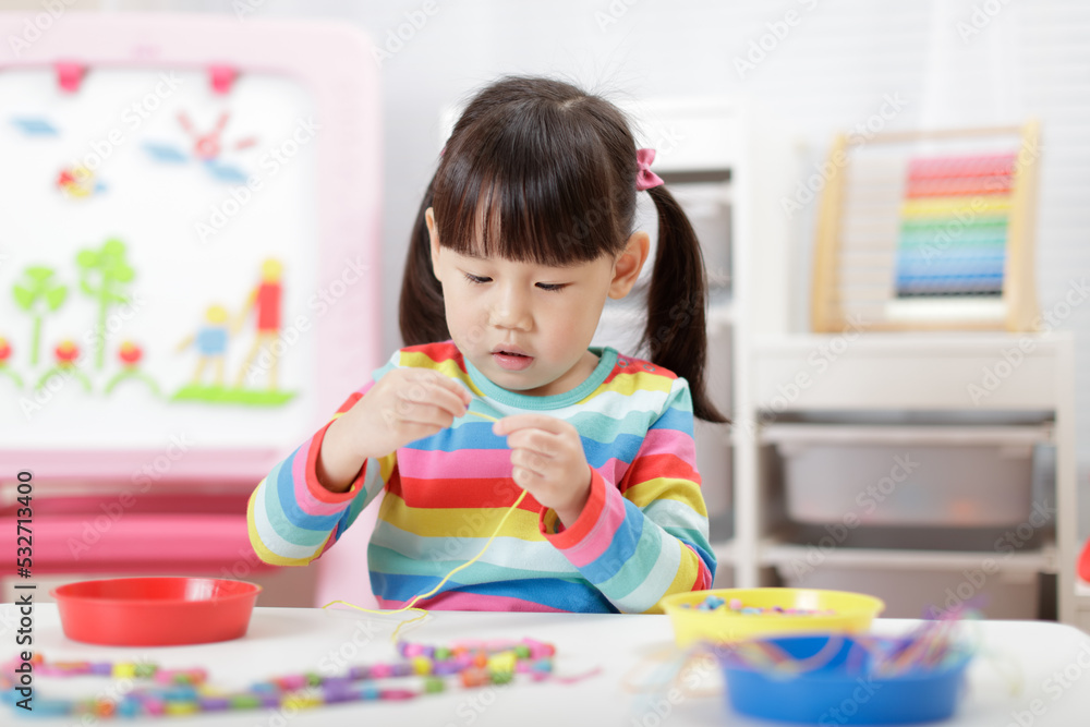 young girl string wooden bead craft for homeschooling young girl string wooden bead craft for homeschooling