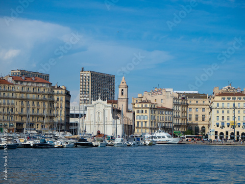 Marseille, France - May 15th 2022: Crossing the old harbour in front of Eglise Saint-Ferreol les Augustins