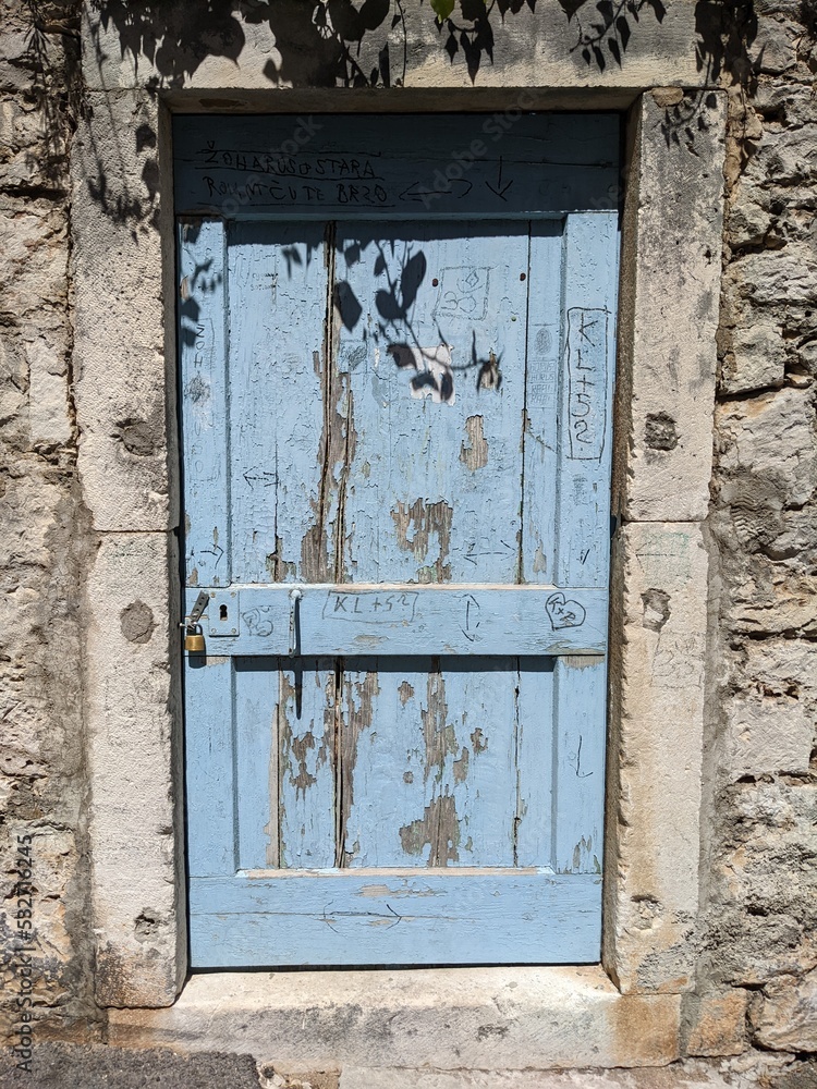 Old wooden door in the wall