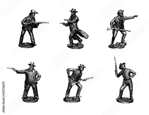 Cowboys. Gunslingers from the Wild West in different poses. Photo with tin figures. photo