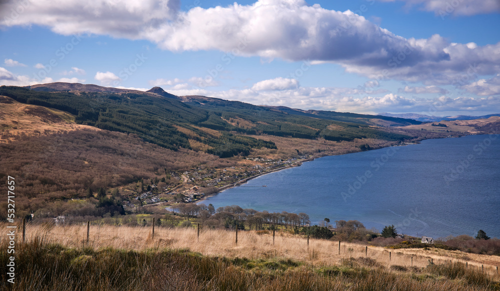 Mid morning and a view of Loch Fyne with houses lining the shore in Strachur Bay. South from the hills above Strachur. Argyll and Bute Mid morning and a view of Loch Fyne with houses lining the shore in Strachur Bay. South from the hills above Strachur. Argyll and Bute