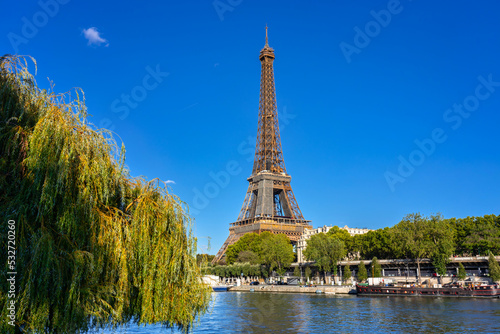 Eiffel Tower by the Seine River in Paris at summer. France
