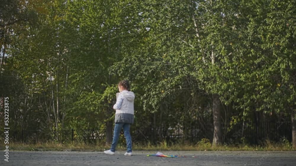 a child in a vest cannot fly a kite