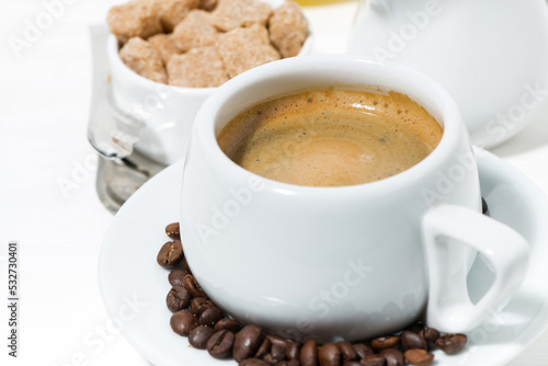 morning cup of espresso on a white background, closeup