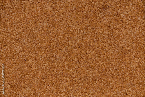 top view of cane sugar background, unrefined natural brown