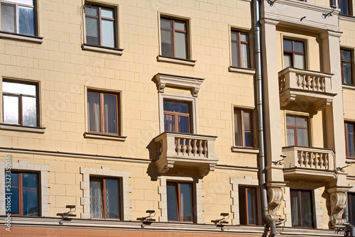Balcony with with balustrade, old residential building. Stalinist architecture, building on Independence Avenue in Minsk. Stalin Empire style. Balcony of soviet building.