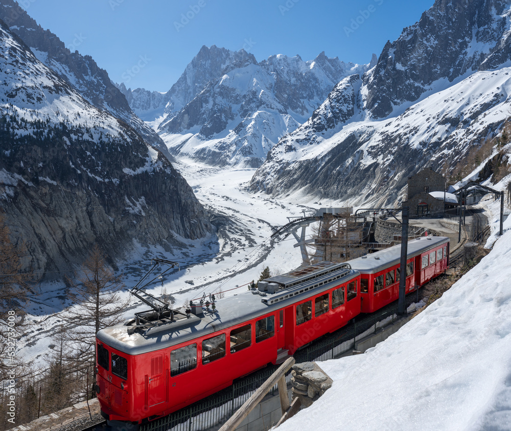 Montenvers train (cogwheel train) with Les Grandes Jorasses peaks and Mer de Glace glacier. View