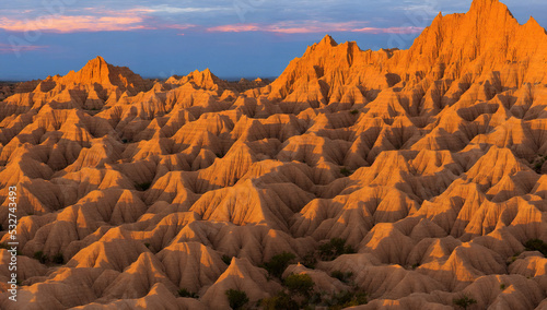 The Badlands National Park, South Dakota during late day sunset with tall rock formations - Beautiful Landscape Panorama