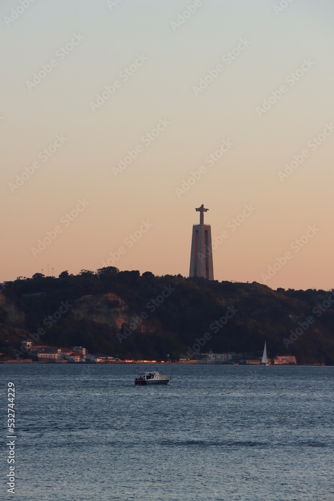 Christ statue in Lisbon at dusk