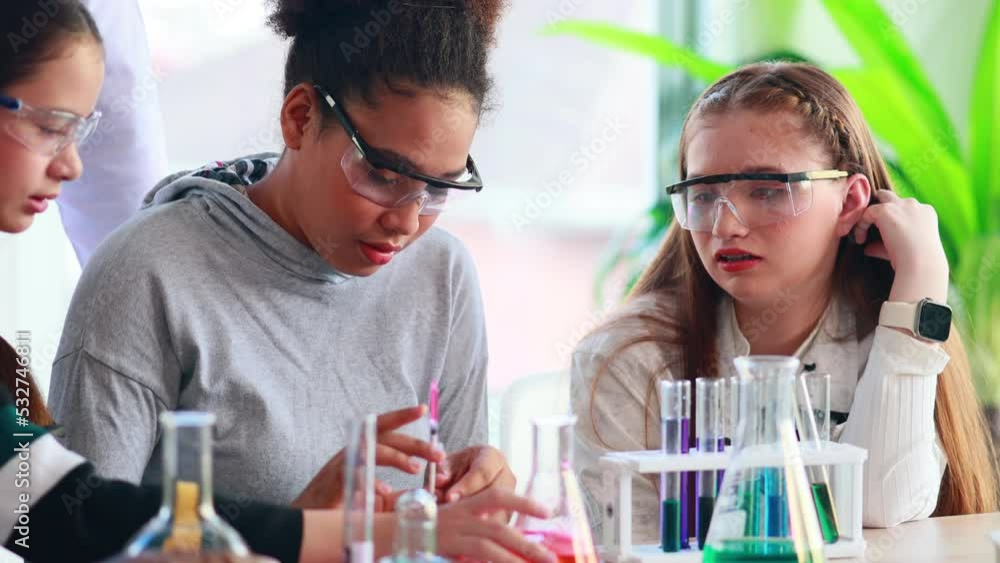science experiment. African american and diversity teenage students caring out experiments in chemistry class science experiment. African american and diversity teenage students caring out experiments in chemistry class