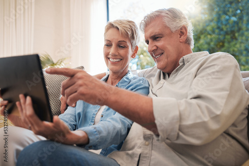 Senior couple, tablet and social media communication or video call of elderly husband and wife relaxing on couch at home. Happy retired man and woman streaming online internet web content on tech.