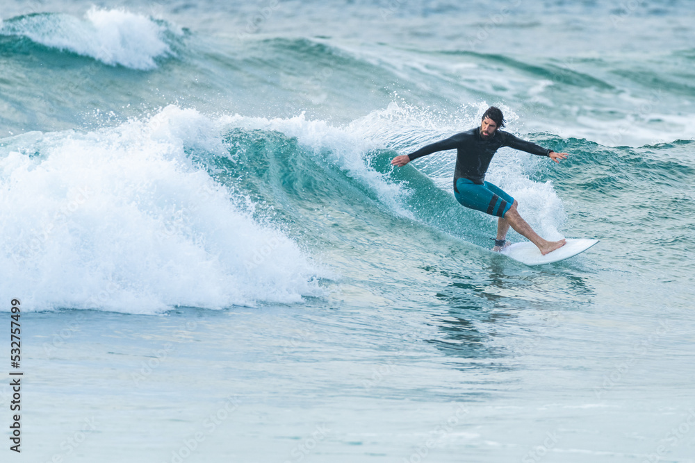 Local surfer riding waves Local surfer riding waves