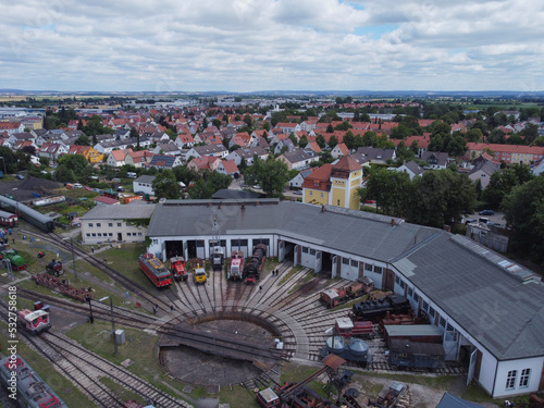 Aerial view of colorful freight trains on the railway station. 