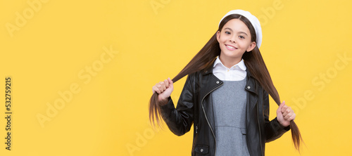 Expert care for every haircare need. School age kid hold long hair. Hair salon. Child face, horizontal poster, teenager girl isolated portrait, banner with copy space. © Olena