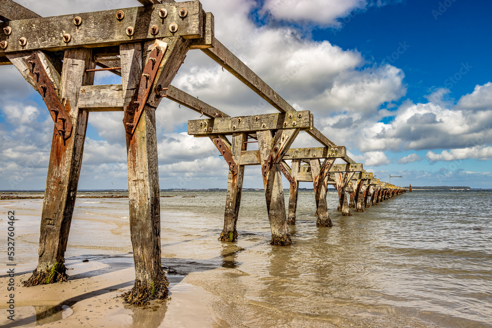 Remains of the old pier in Queern on the Baltic Sea