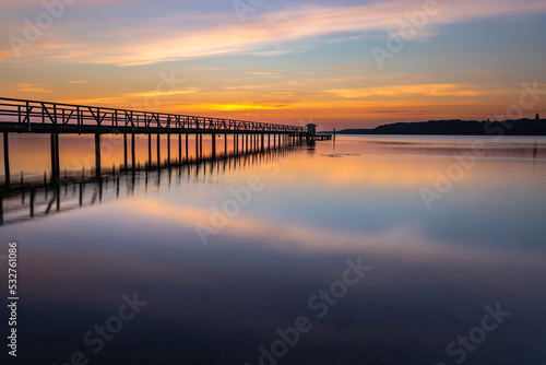 Fototapeta Naklejka Na Ścianę i Meble -  Pier in Harrislee, Flensburg, Baltic Sea at sunrise
