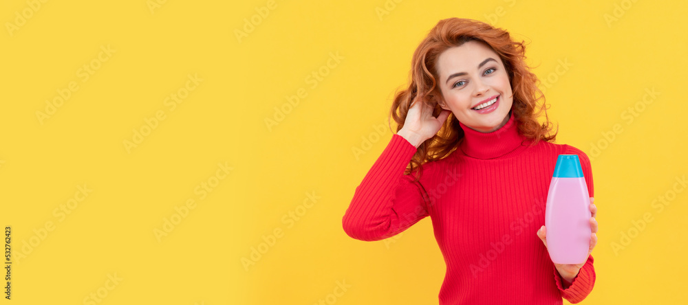 happy woman use shower gel. positive girl curly hair hold shampoo bottle. hair conditioner happy woman use shower gel. positive girl curly hair hold shampoo bottle. hair conditioner